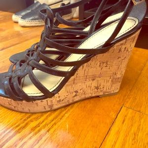 Enzo Angiolini Black leather strap wedges.